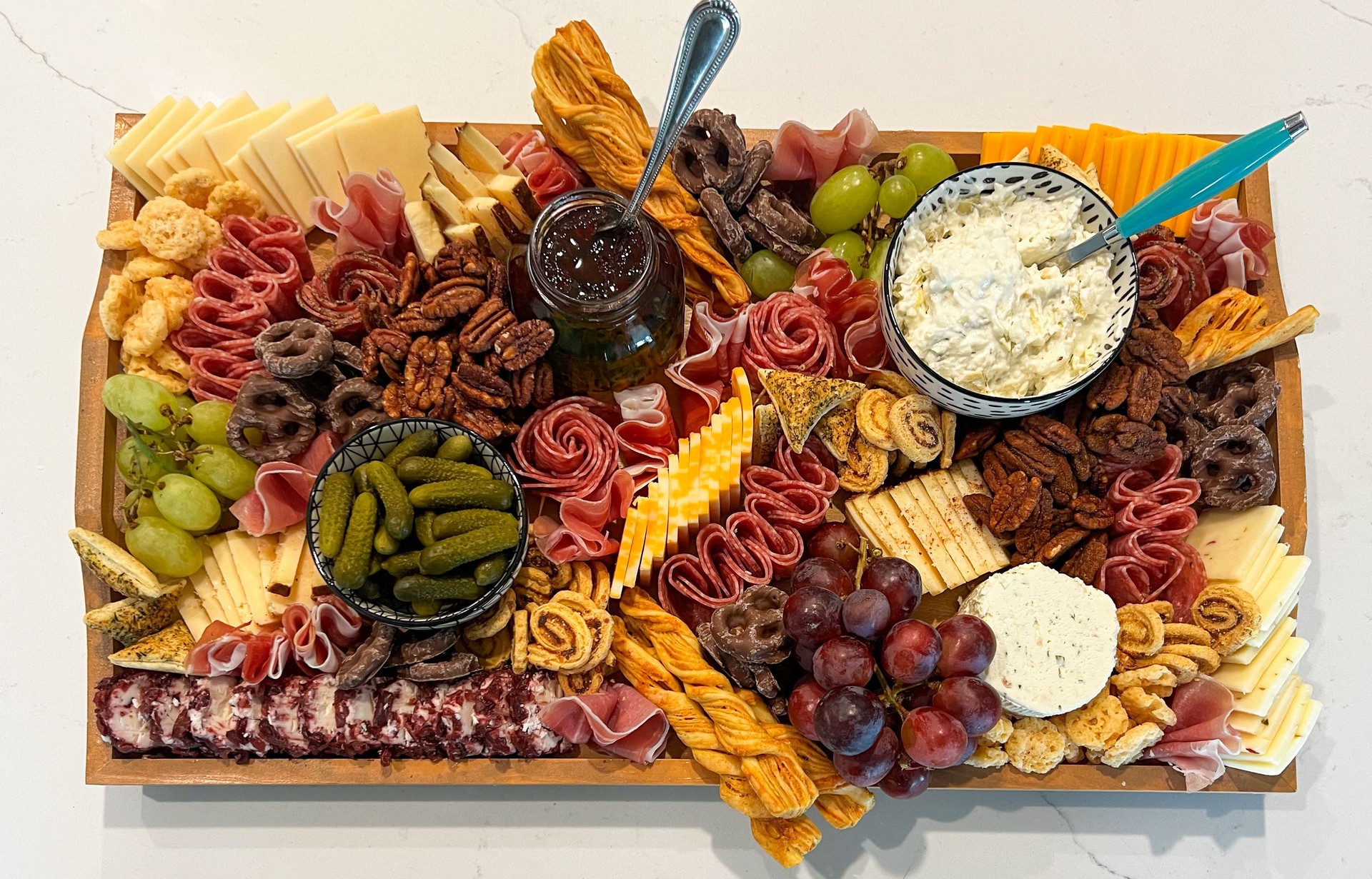 Gourmet Charcuterie Board with Cheeses, Dips, and Fresh Fruit