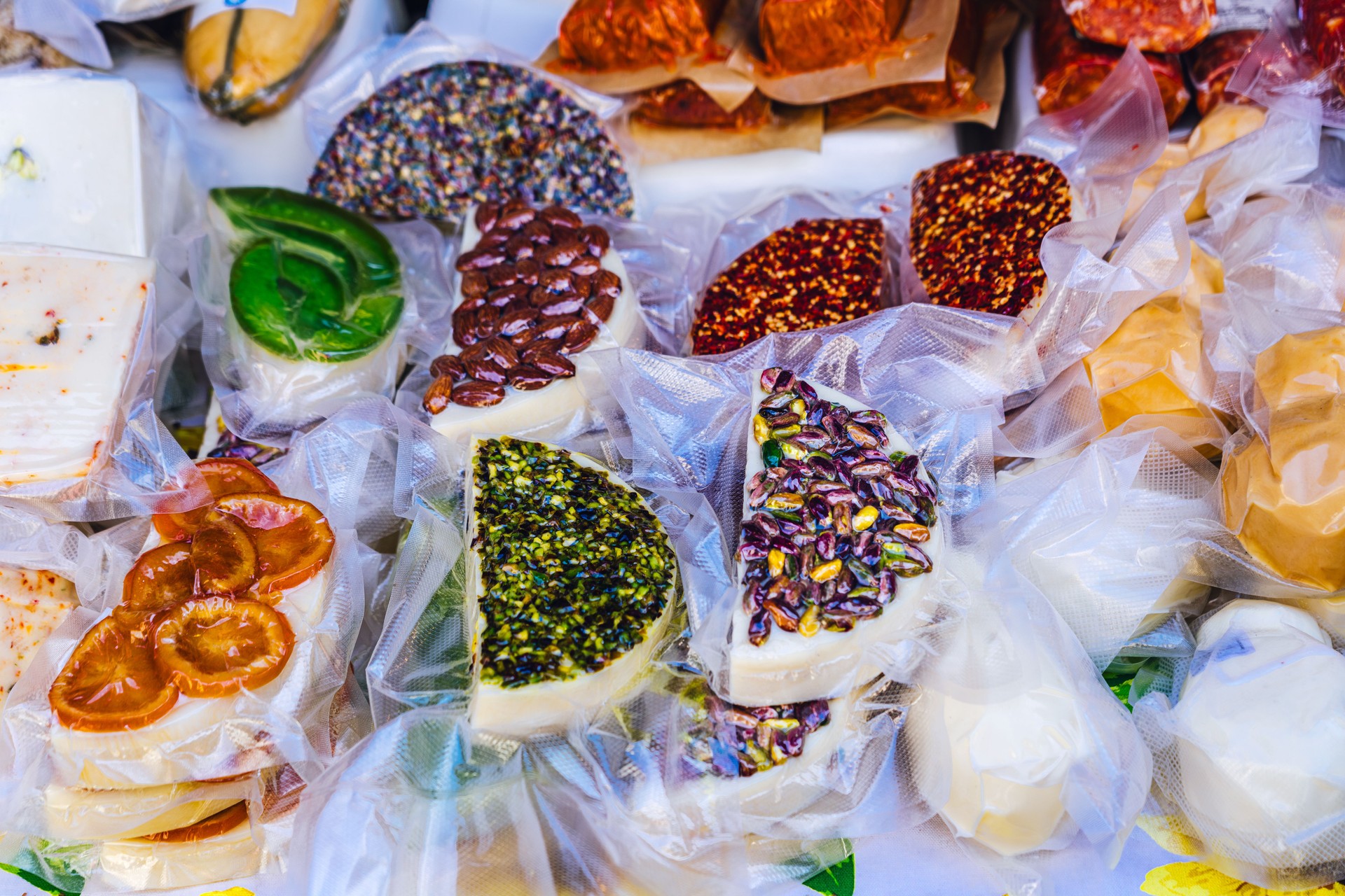 Assorted Gourmet Cheeses Decorated with Dried Fruits and Seeds